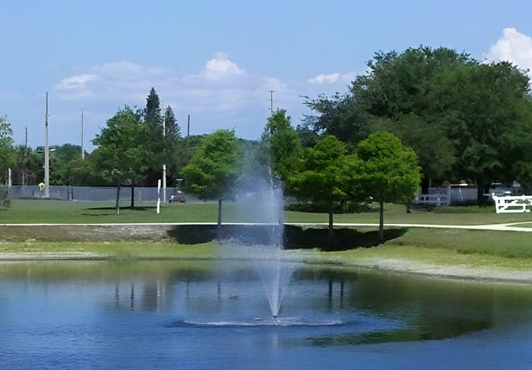 A fountain in the middle of a park.