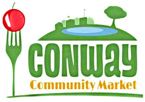 A green banner with the words conway community market in front of it.